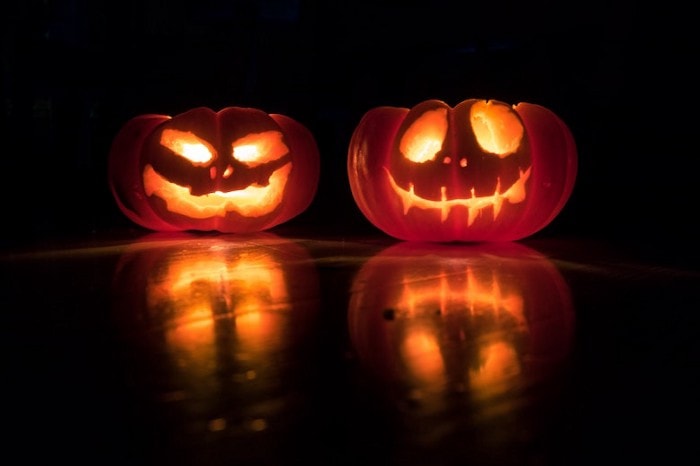 carved pumpkins with candles inside