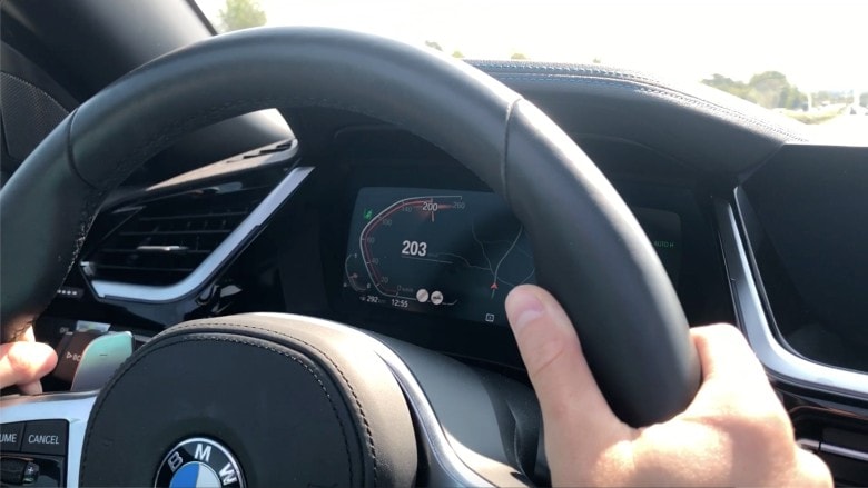 Image of a BMW steering wheel at 203 kmh