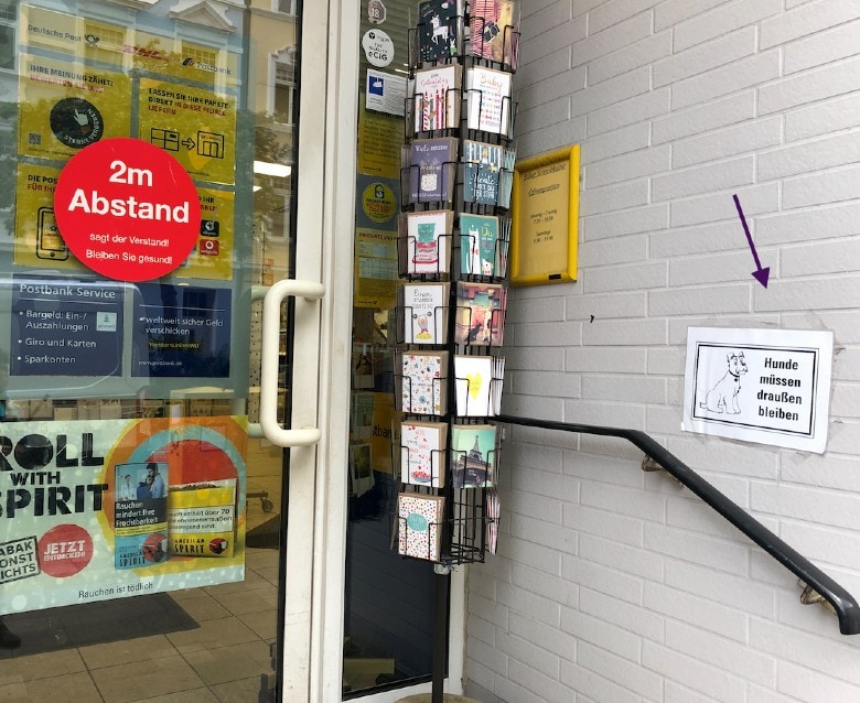 A typical 'Dogs have to stay outside' sign at a postal office in Germany